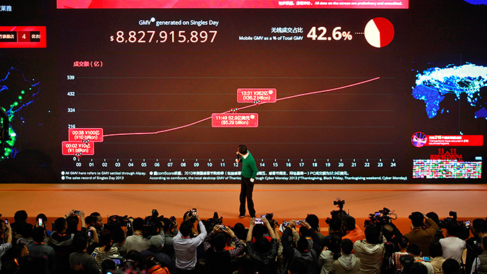 Alibaba Group Executive Chairman Jack Ma looks back at a giant electronic screen showing real-time sales figures of the company's Taobao.com and Tmall.com, on the Singles' Day online shopping festival, at the company headquarters in Hangzhou, Zhejiang province (Reuters / Stringer)
