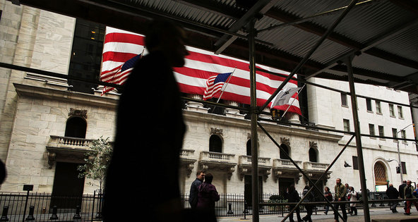 Outside the New York Stock Exchange in the financial district, where jobs have been pared back.