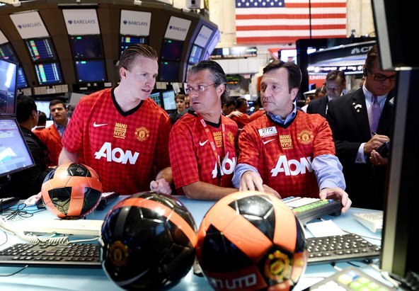 Traders wearing Manchester United jerseys on the floor of the New York Stock Exchange on Friday.