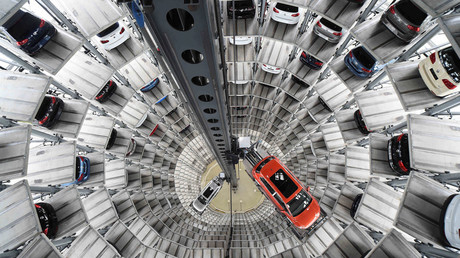 A VW Golf VII car (R) and a VW Passat are loaded in a delivery tower at the plant of German carmaker Volkswagen in Wolfsburg © Fabian Bimmer 