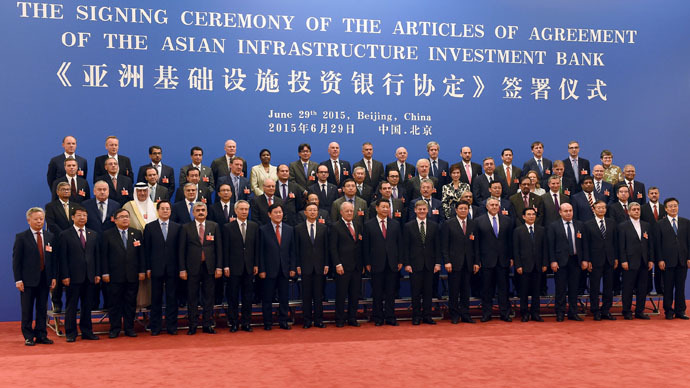 Chinese President Xi Jinping (C, front) poses for a group photo with the delegates attending the signing ceremony for the Articles of Agreement of the Asian Infrastructure Investment Bank (AIIB) at the Great Hall of the People in Beijing June 29, 2015. (Reuters/WANG ZHAO)