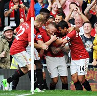 Manchester United team members celebrated a victory against Wigan on Saturday.