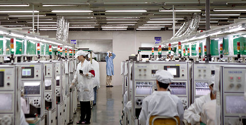 A production line in Foxconn City in Shenzhen, China. The iPhone is assembled in this vast facility, which has 230,000 employees, many at the plant up to 12 hours a day, six days a week.