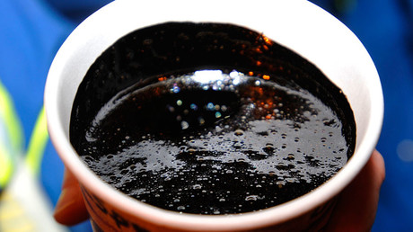 A cup of heavy oil produced at the Statoil oil sands operation near Conklin, Alberta © Todd Korol 