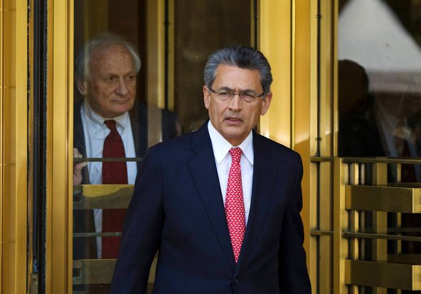 Former Goldman Sachs board member Rajat Gupta (R) leaves Manhattan Federal Court with his lawyer, Gary Naftalis, following a guilty verdict.