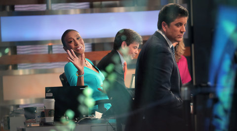 Robin Roberts waved to fans outside the Good Morning America studio on her first day back at work following a bone marrow transplant.