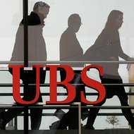 Above, a branch of UBS in Zurich. Three former bank executives were found guilty last week of rigging bids to invest municipal bond proceeds.