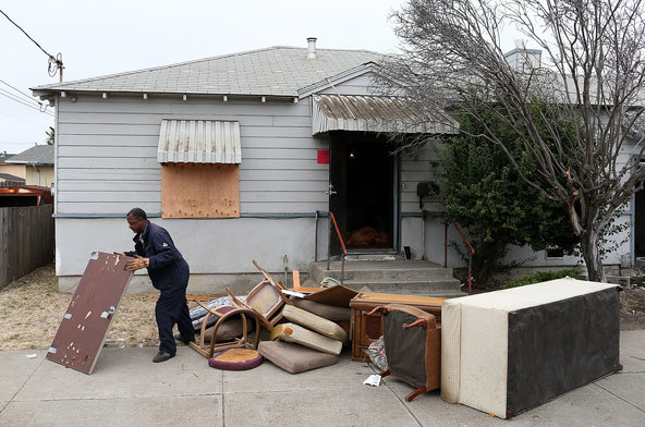 Furniture is removed from a foreclosed house in Richmond, Calif.