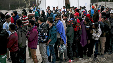 Refugees and migrants line up for a food distribution at the Moria refugee camp on the Greek island of Lesbos © Alkis Konstantinidis
