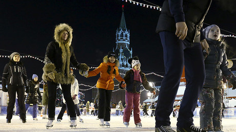 People skate at an ice rink on its first day of operation in front of GUM department store in Moscow's Red Square. © Sergei Karpukhin