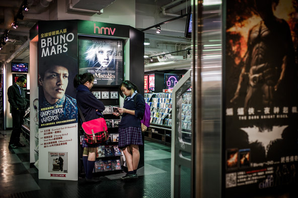 Students listen to CDs in a HMV store in Hong Kong.