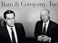 Mitt Romney, left, with William W. Bain Jr. in 1990. Mr. Romney began his rise in business working for Mr. Bain, who encouraged him to move into the private equity firm that he ran for 15 years.