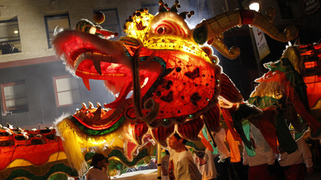Participants perform a dragon dance during the annual Chinese New Year Parade © Stephen Lam