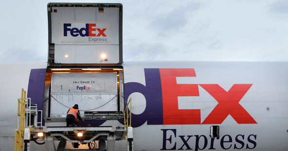 A FedEx plane is unloaded in Los Angeles.