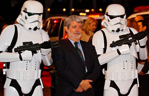 George Lucas in 2005, flanked by stormtroopers from his 