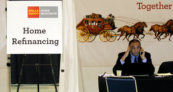 A Wells Fargo booth at a mortgage-refinancing workshop in January in Seattle.