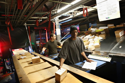 Sorting FedEx packages in Chicago.