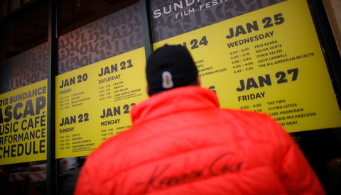 At the Sundance Film Festival, volunteers are wearing salmon-ish jackets from Kenneth Cole.