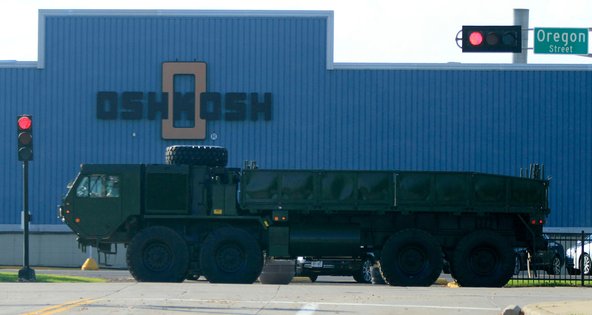 A military vehicle passes by the Oshkosh plant in Wisconsin.