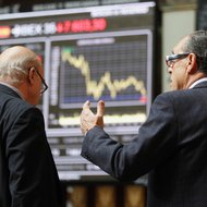 Traders at the bourse in Madrid on Tuesday.