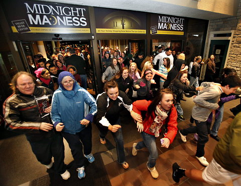 Black Friday shoppers rush into Valley River Center mall in Eugene, Ore.