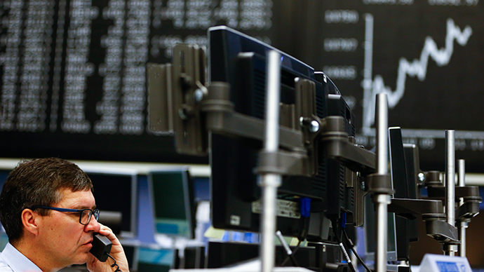 A trader works at his screen at the Frankfurt stock exchange January 26, 2015 (Reuters / Kai Pfaffenbach)