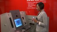 Bank of America's new A.T.M.'s offer on-screen help from human tellers.