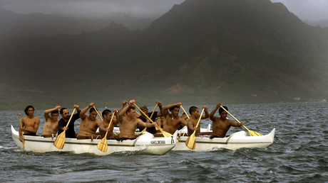 Members of the Keahiakahoe Canoe Club of Kahalu'lu paddle from Kuoloa Beach Park, to Hale Koa Beach on Marine Corp Base Hawaii © Lucy Pemoni 