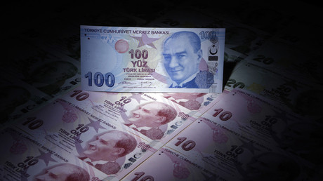 A Turkish 100 lira banknote is seen on top of 10 lira banknotes in this illustration picture taken in Istanbul © Murad Sezer 