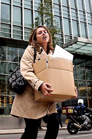 A Lehman Brothers employee exits the firm's London offices in 2008.