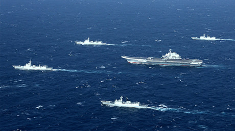 FILE PHOTO: China's Liaoning aircraft carrier with accompanying fleet conducts a drill in an area of South China Sea in this undated photo taken December, 2016 © Stringer