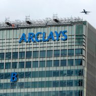 The letter B is hoisted up the side of Barclays' headquarters in London.