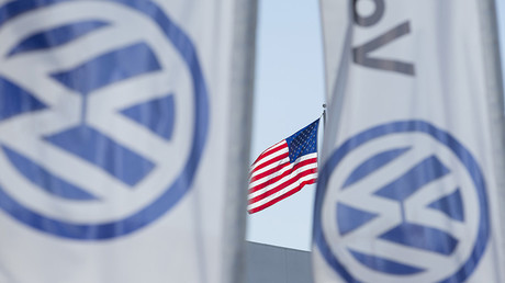 An American flag flies next to a Volkswagen car dealership in San Diego, California © Mike Blake