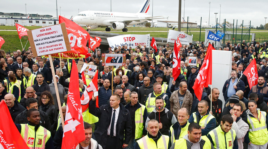 Striking employees of Air France demonstrate in front of the Air France headquarters building at the Charles de Gaulle International Airport in Roissy, near Paris, France, October 5, 2015. © Jacky Naegelen 