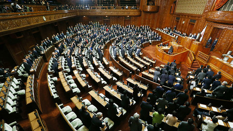Ruling coalition lawmakers stand to approve the passage of the Trans-Pacific Partnership (TPP) free trade deal in the lower house of the parliament in Tokyo on November 10, 2016. © JiJi PRress