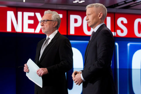 CNN’s Wolf Blitzer, left, and Anderson Cooper will report from positions along the parade route on Monday.