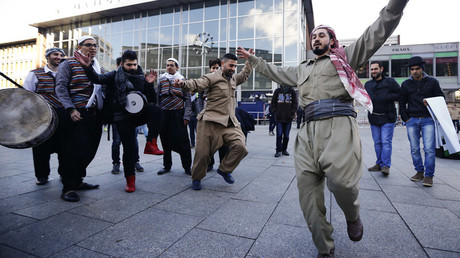 FILE PHOTO Migrants dance in front of the railway station  in Cologne, Germany © Wolfgang Rattay