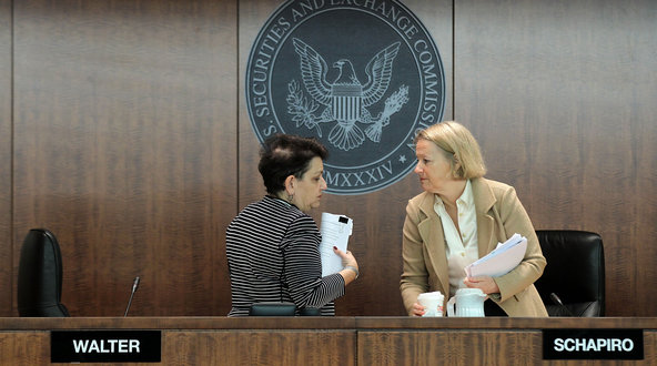 Mary L. Schapiro, right, and Elisse B. Walter at a meeting of the Securities and Exchange Commission last year.