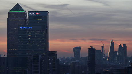 Canary Wharf and the city are seen at sunset in London. © Eddie Keogh