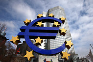 A euro sign sculpture in front of the European Central Bank's headquarters in Frankfurt, Germany. 