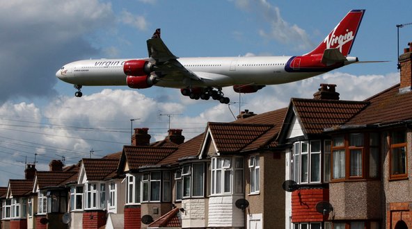 A Virgin Atlantic plane comes in to land at Heathrow Airport.