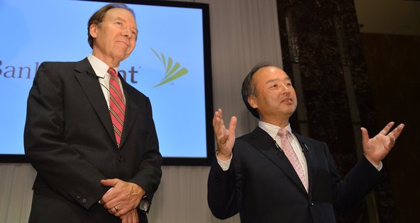 Daniel Hesse, left, the chief of Sprint Nextel, and Masayoshi Son, the president of SoftBank, announced the deal in Tokyo on Monday.