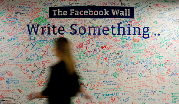 A wall at Facebook’s New York office is signed by employees. The company may go public in 2012.
