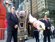 United NY protested outside of Bain Capital,  using the character of Bane, the villain who faced off against Batman in The Dark Knight Rises.