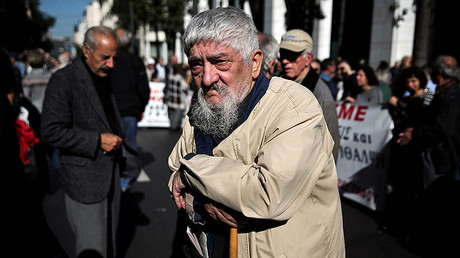 A Greek pensioner leans on a shepherd's crook during a demonstration against planned pension cuts in Athens © Alkis Konstantinidis