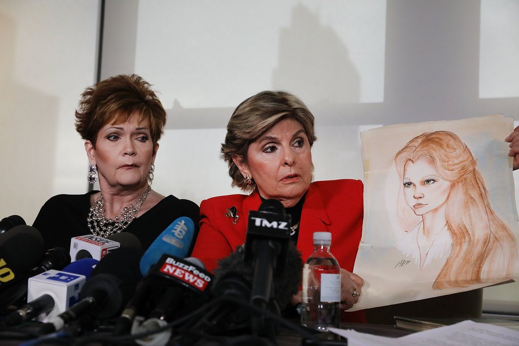 The lawyer Gloria Allred held up a sketch of Beverly Young Nelson, left, as a teenager, at a news conference in early November. Ms. Nelson has accused Roy Moore of sexual misconduct.