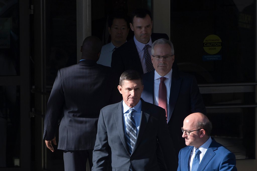 Michael Flynn, center, leaving court in Washington on Friday.