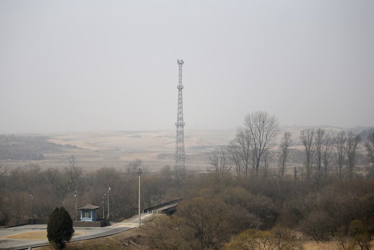 North Korea’s surveillance cameras sit atop a steel tower overlooking the South, near the border village of Panmunjom.